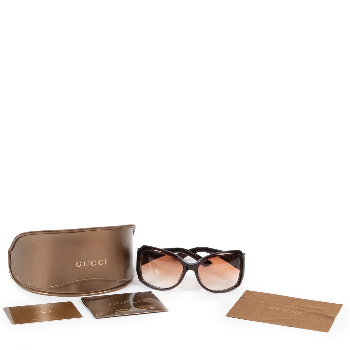 Achetez en ligne second main ces lunettes Gucci en brun.
