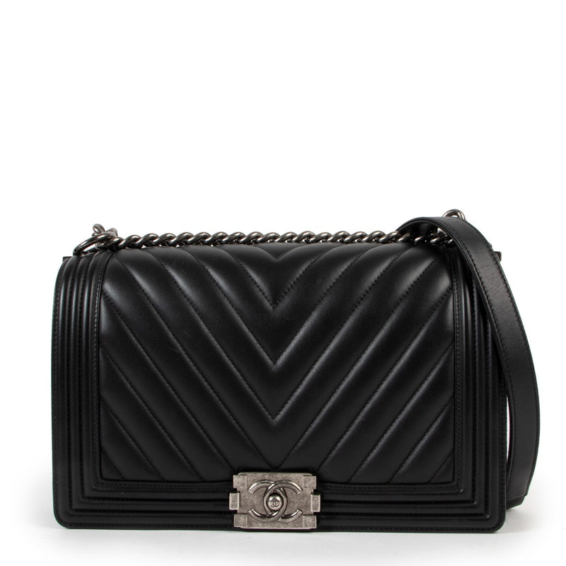 Best designer luxury second hand vintage Chanel Black Boy New Medium Chevron Quilted Calfskin Bag at Labellov.