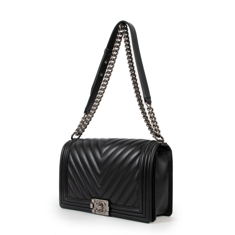 Best designer luxury second hand vintage Chanel Black Boy New Medium Chevron Quilted Calfskin Bag at Labellov.