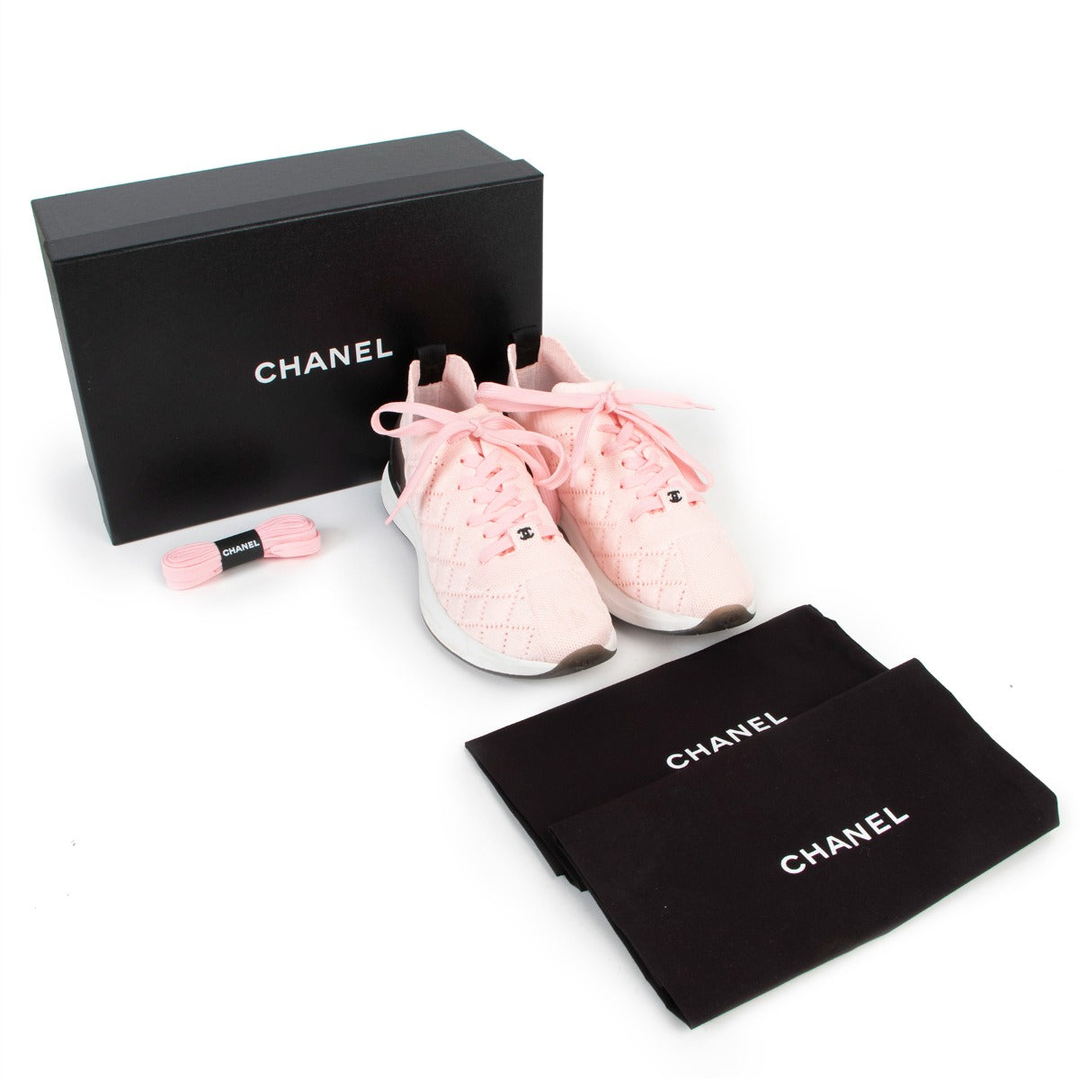 Buy online authentic second hand Chanel pink mixed fiber quilted sneakers in very good condition at Labellov in Antwerp.