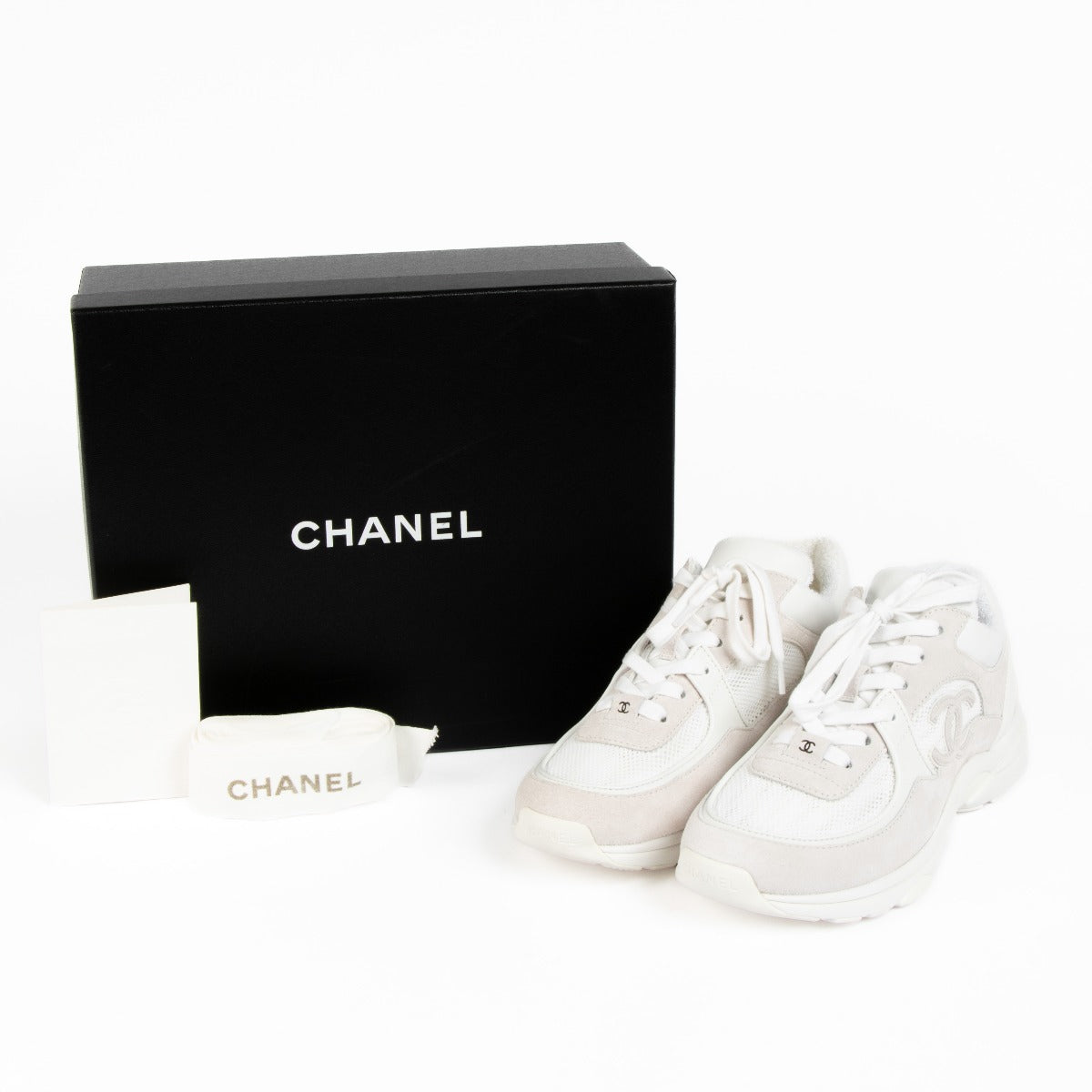 Authentic pre-loved Chanel White Logo Sneakers - Size 39.5 on Labellov.com