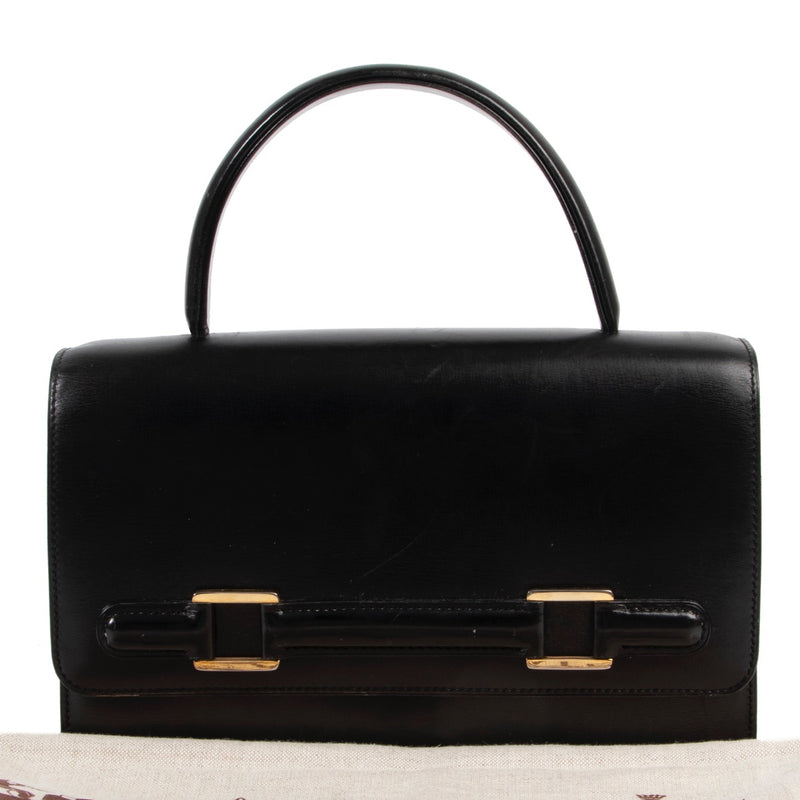 Veilig online kopen van een vintage authentieke Delvaux top handle handtas in zwart leer bij Labellov.com.