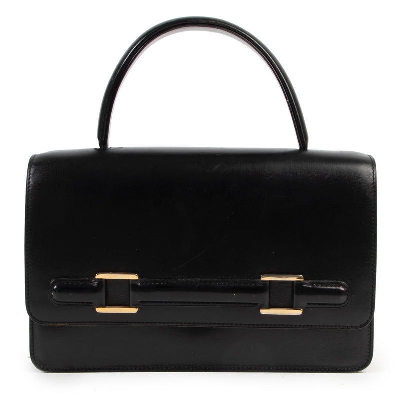Shop online vintage Delvaux black leather top handle bag at Labellov.com.