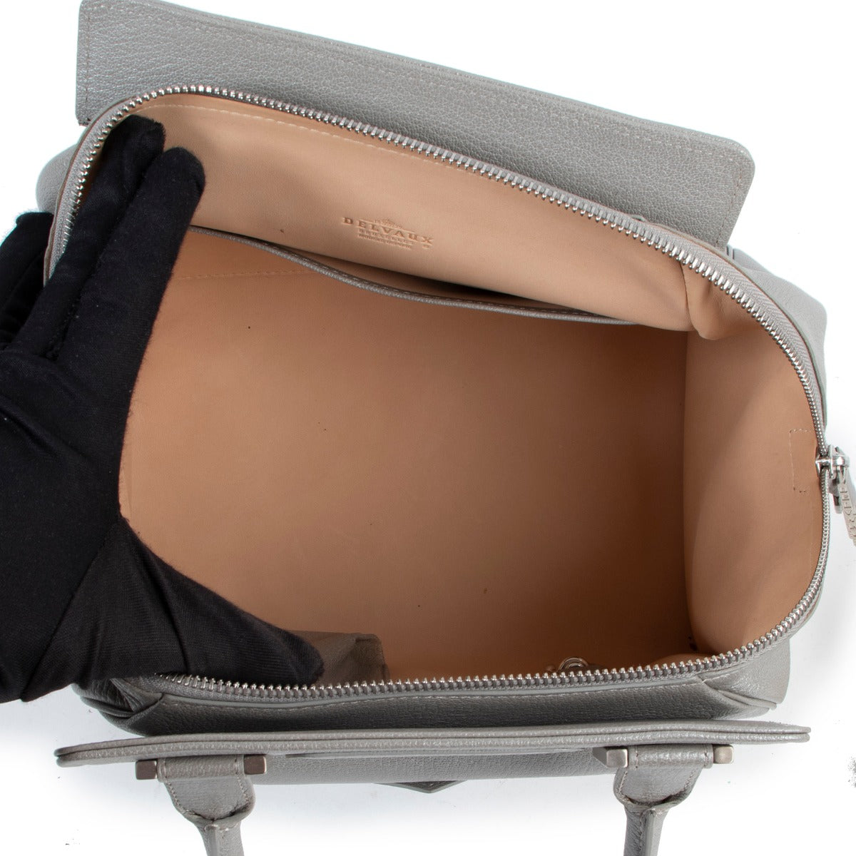 Buy and sell your Delvaux Gris Clair Coquin MM Top Handle Bag at Labellov for a reasonable price and in good condition.