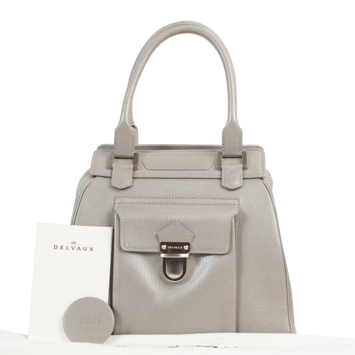 Buy and sell your Delvaux Gris Clair Coquin MM Top Handle Bag at Labellov for a reasonable price and in good condition.