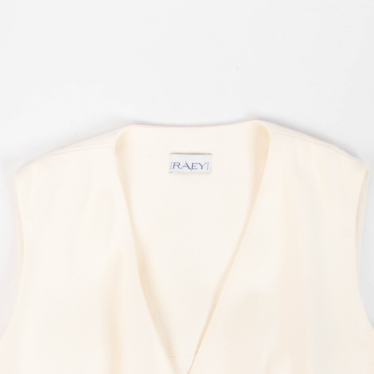 Raey Manteau long sans manches couleur crème