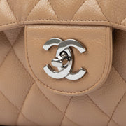 Shop this authentic second hand Chanel Beige Caviar Leather Large Classic Flap Bag on Labellov.com