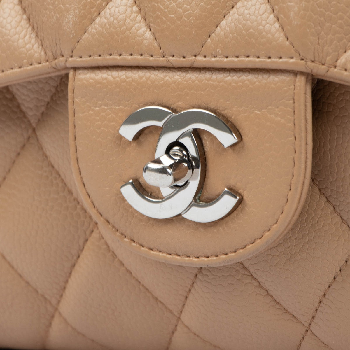 Shop this authentic second hand Chanel Beige Caviar Leather Large Classic Flap Bag on Labellov.com