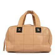 Shop this authentic second hand Chanel Beige Square Quilt Leather Bowler Top Handle on Labellov.com