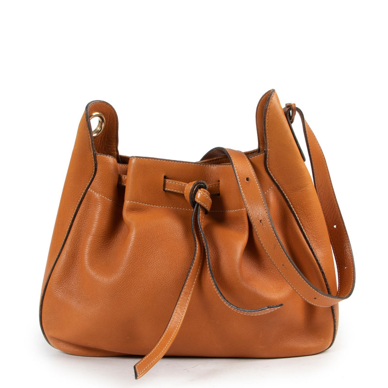 Shop this Delvaux Cognac Shoulder Bag at Labellov in store or online. Shop at Labellov for true authentic designer items.