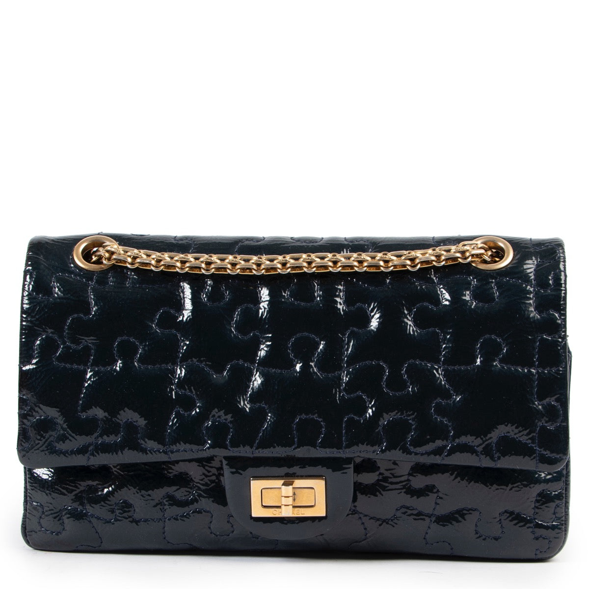 Shop safe online at Labellov in Antwerp this 100% authentic second hand Chanel Blue Patent Reissue 2.55 Puzzle Bag