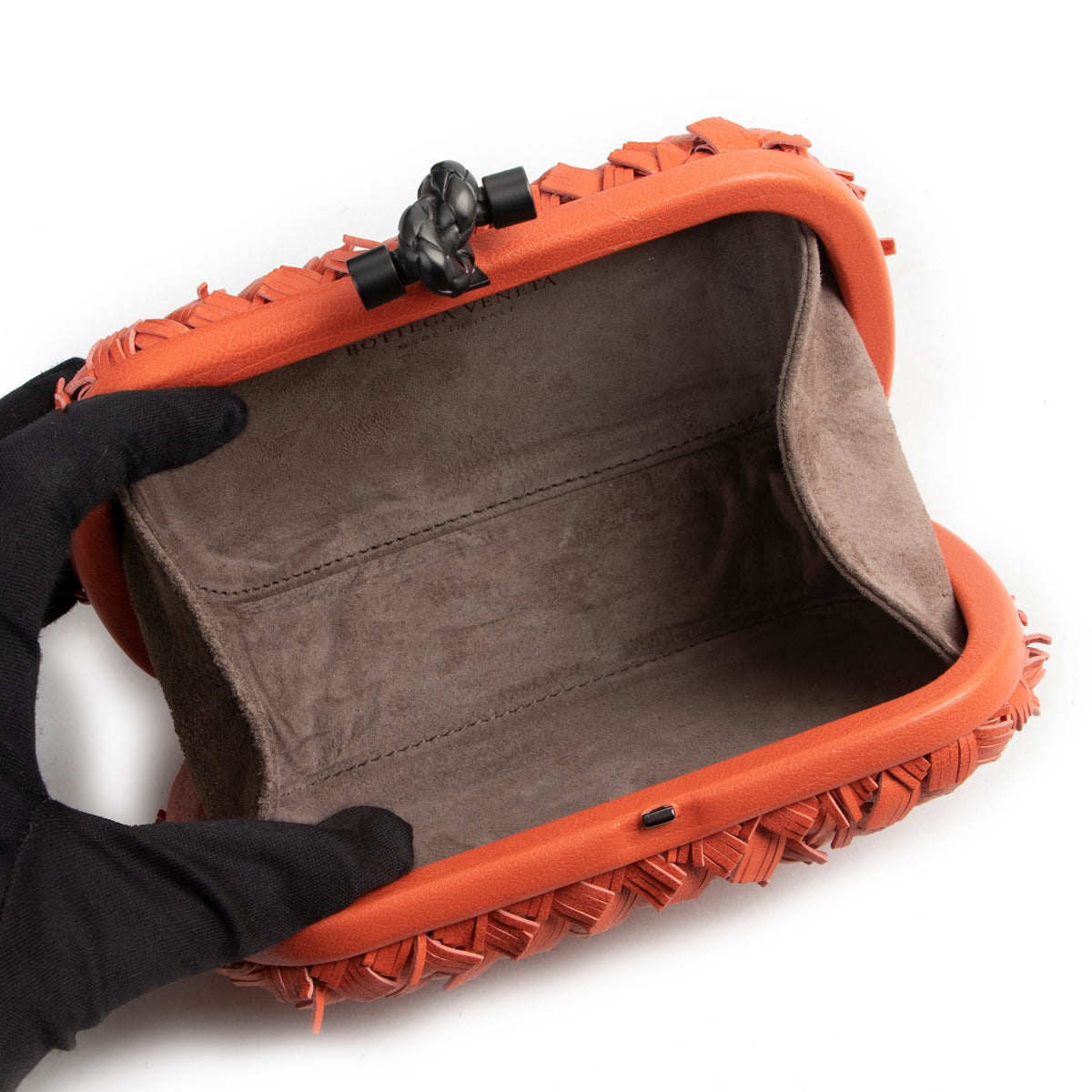 Buy in very good condition a Bottega Veneta Orange Clutch