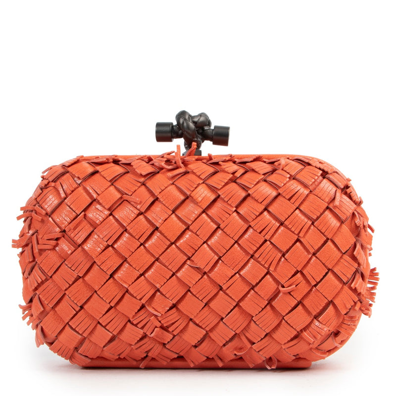Buy in very good condition a Bottega Veneta Orange Clutch