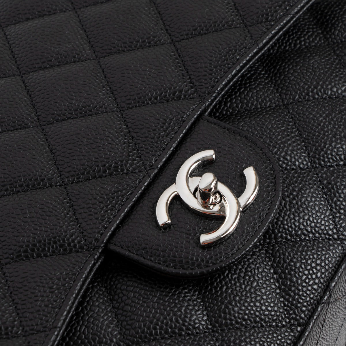 Chanel Black Caviar Leather Maxi Classic Flap Bag CC Turnlock detail