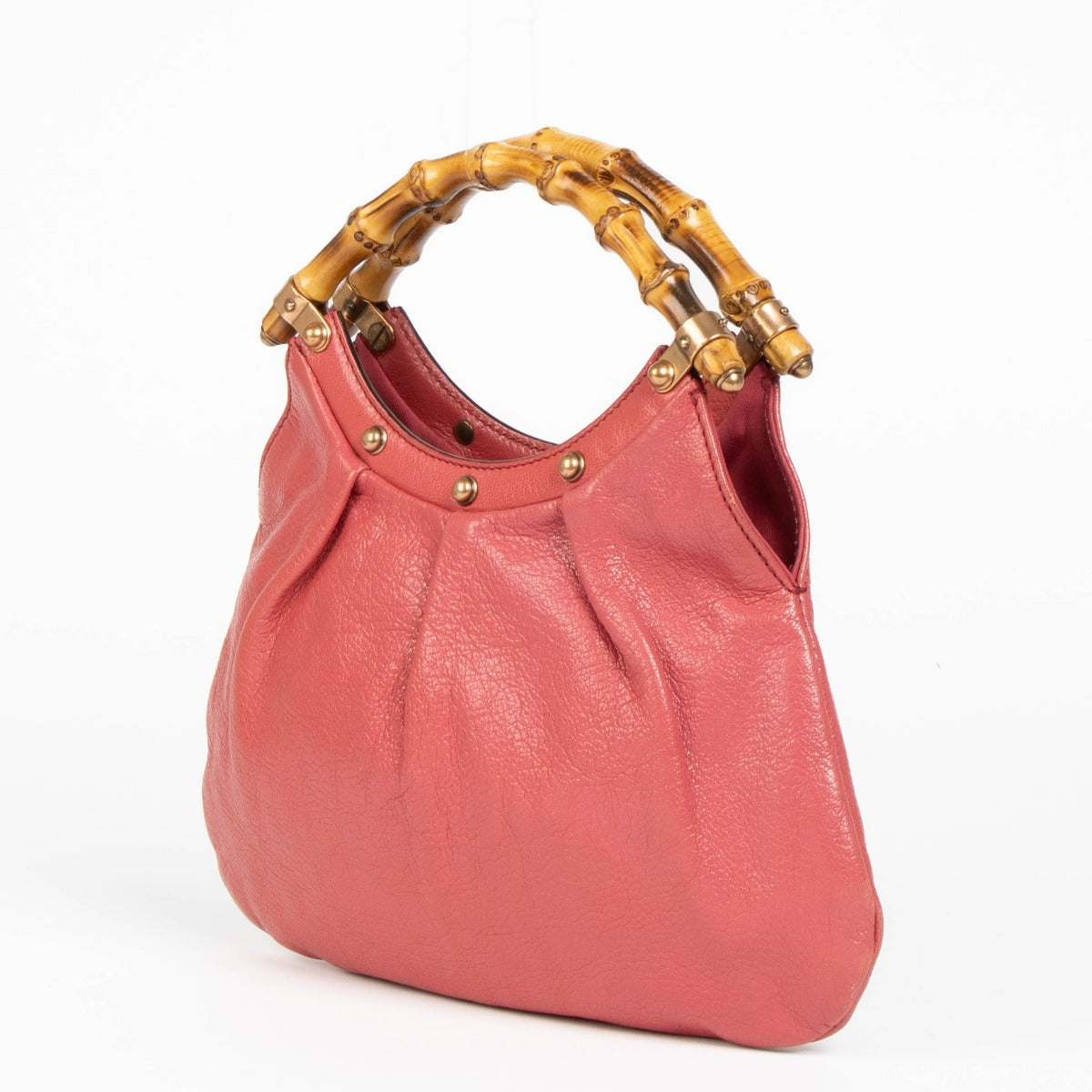 Shop this 100% authentic Gucci Pink Pebbled Leather Bamboo Handle Hobo Bag at labellov.com.