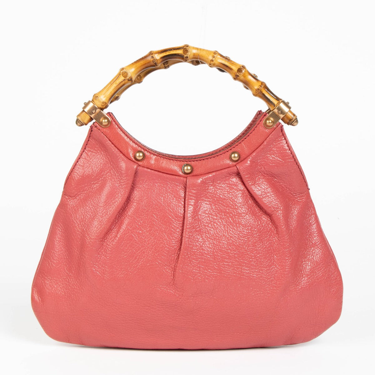 Shop this 100% authentic Gucci Pink Pebbled Leather Bamboo Handle Hobo Bag at labellov.com.