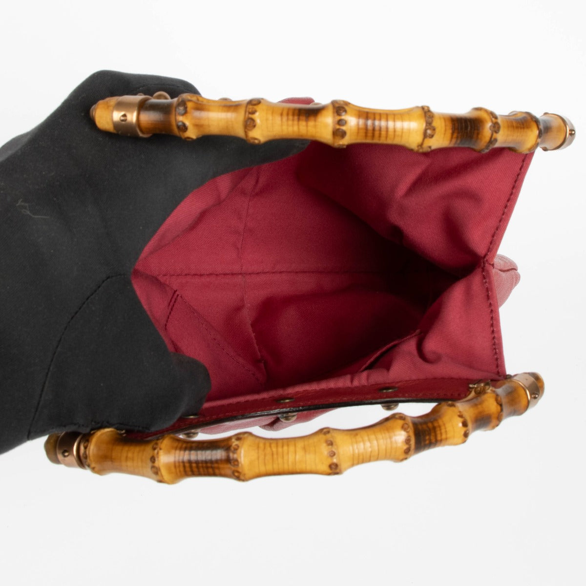 Shop this 100% authentic Gucci Pink Pebbled Leather Bamboo Handle Hobo Bag at labellov.com.