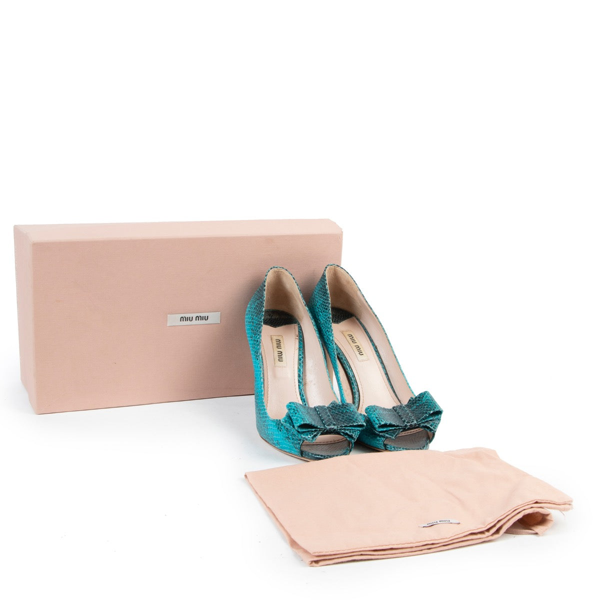 Shop safe online authentic second hand Miu Miu Blue Python Peep-Toe Pumps. But online Miu Miu Blue Python Peep-Toe Pumps in a safe way. Shop Miu Miu Blue Python Peep-Toe Pumps online safely.