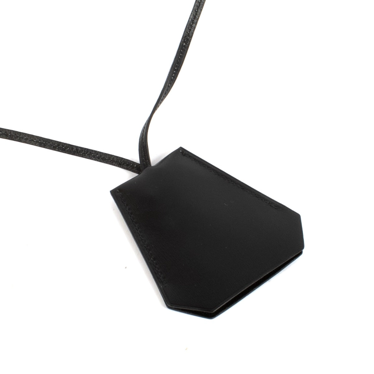 Shop safe online at Labellov in Antwerp, Brussels and Knokke this 100% authentic second hand Hermès Black Margiela Clochette Keyring Necklace