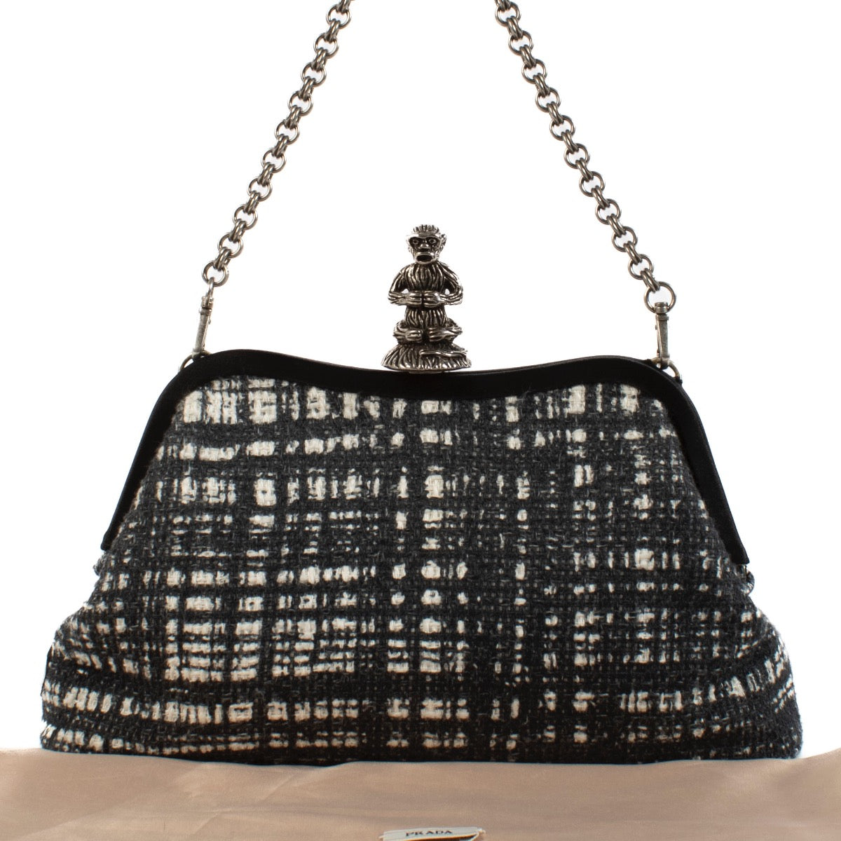 Shop 100% authentic Prada Grey Tweed Monkey Closure Chain Clutch at Labellov.com.