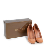 The Gucci Nude Patent Leather Pumps secondhanded in very good condition