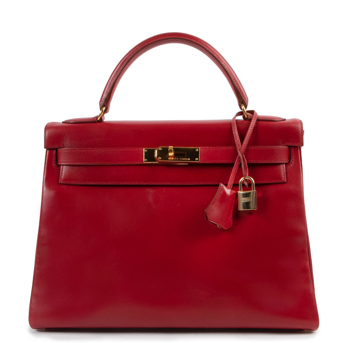 Shop safe online 100% authentic second hand Hermès Kelly Retourne 32 Smooth Red Veau Tadelakt Calfskin GHW at Labellov in Antwerp.