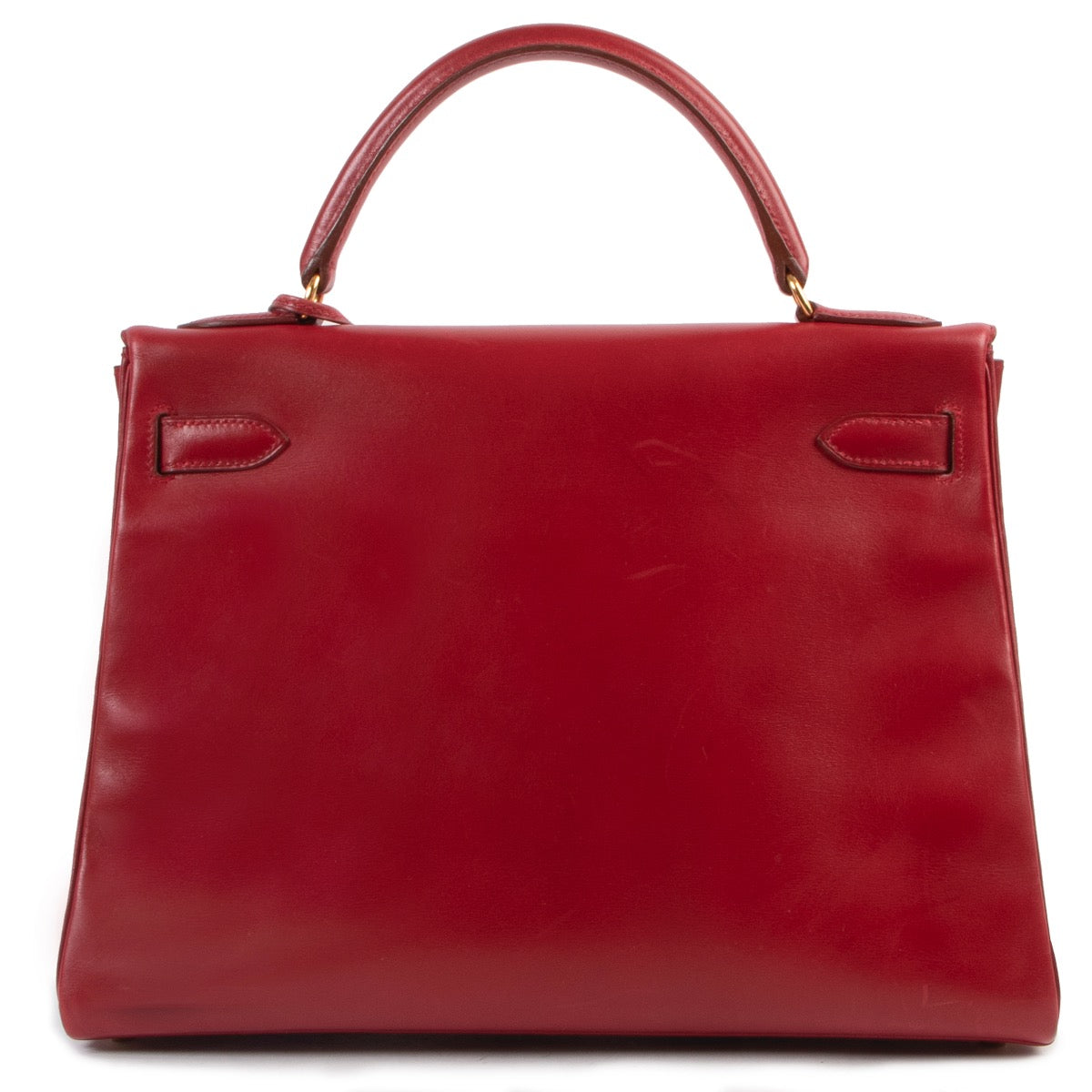Shop safe online 100% authentic second hand Hermès Kelly Retourne 32 Smooth Red Veau Tadelakt Calfskin GHW at Labellov in Antwerp.
