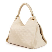 Shop 100% authentic second-hand Louis Vuitton White Monogram Empreinte Artsy MM Shoulder Bag on Labellov.com
