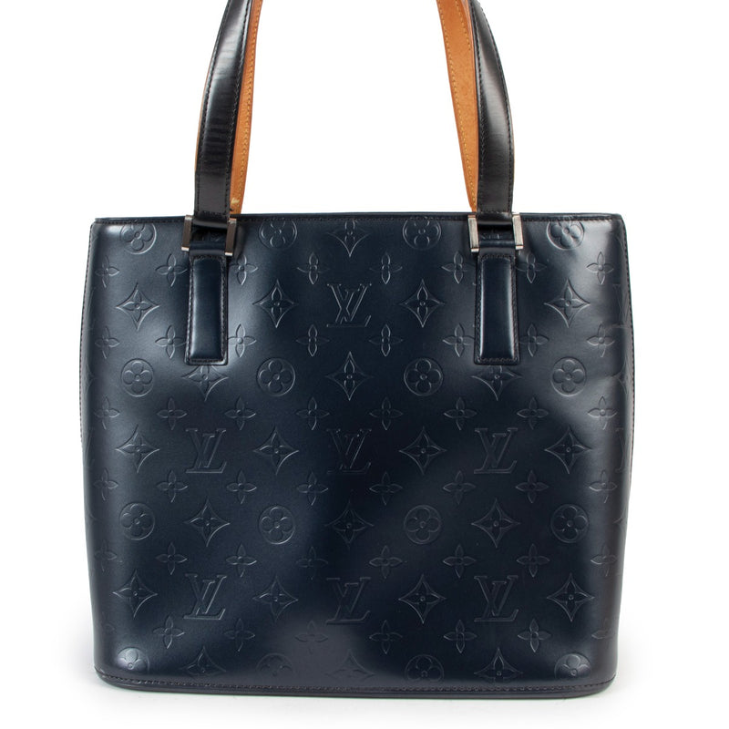 Buy an authentic second hand Louis Vuitton Stockton Blue Monogram Mat Bag in very good condition at Labellov in Antwerp.