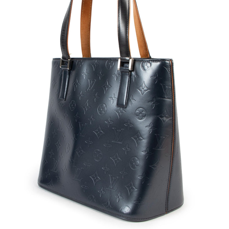 Buy an authentic second hand Louis Vuitton Stockton Blue Monogram Mat Bag in very good condition at Labellov in Antwerp.
