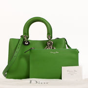 Christian Dior Green Diorissimo Medium Bag for the best price at Labellov secondhand luxury in Antwerp. We buy and sell your preloved and brand new designer bags for the best price.