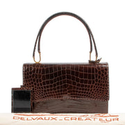 Shop safe online Delvaux Brown Crocodile Top handle for the best price. shop safe online your secondhand Delvaux Brown Crocodile Top handle. Buy authentic secondhand Delvaux bags at Labellov vintage fashion webshop for the lowest price. Koop authentieke