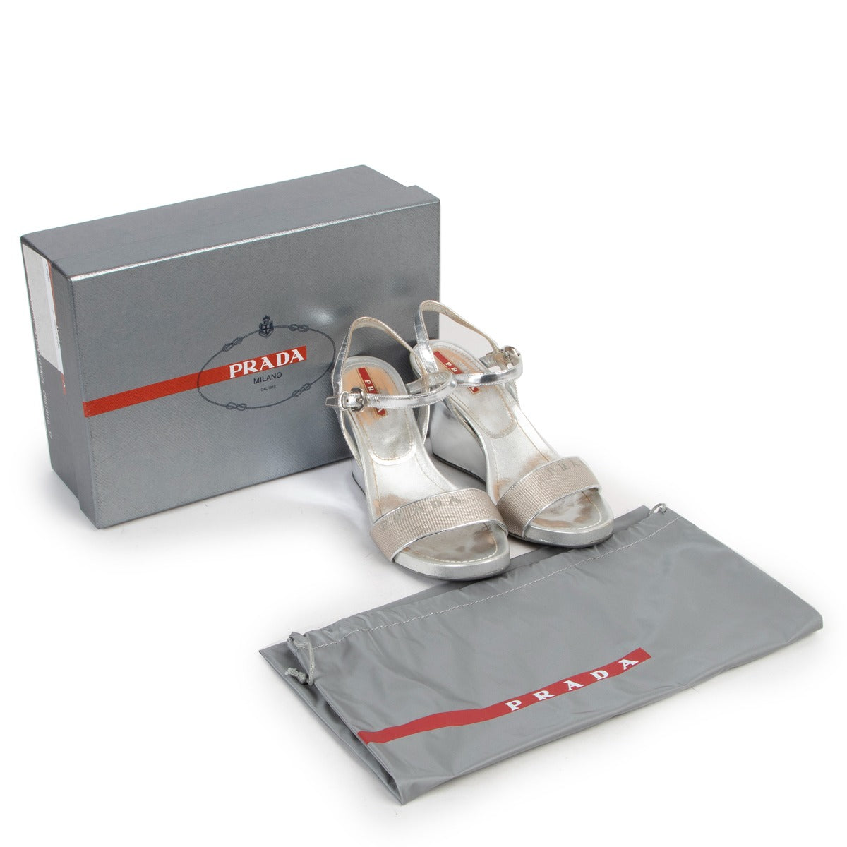 Buy and sell your designer items at Labellov. Get these Prada Silver Wedge Heels - Size 37 at Labellov Luxury online or come by in our showroom with excellent service.