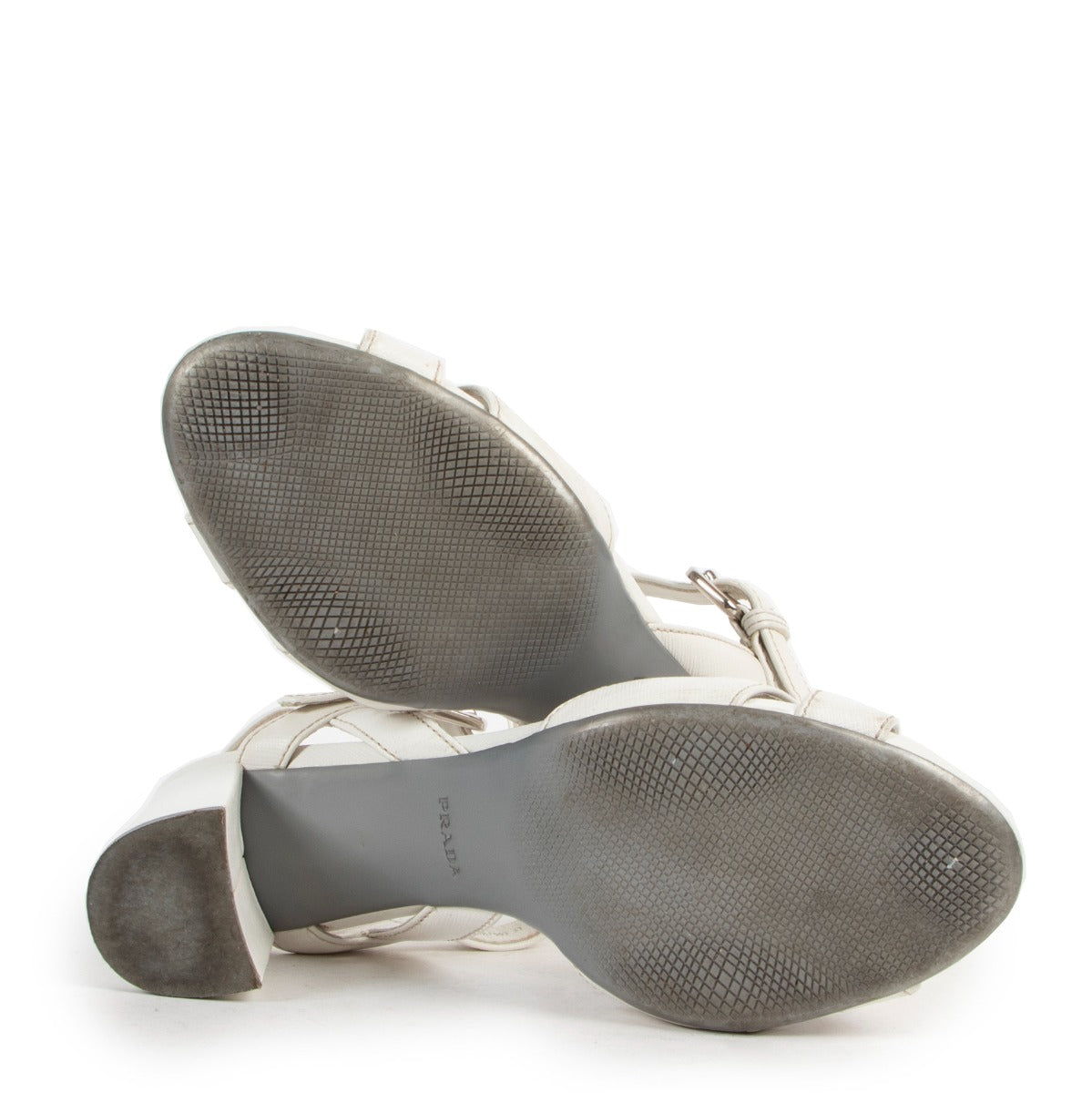 Prada Saffiano 2 Bianco Heels - Size 37 available to buy at Labellov Luxury and ready for a secondlife. Shop secondhand luxury items online or in store.