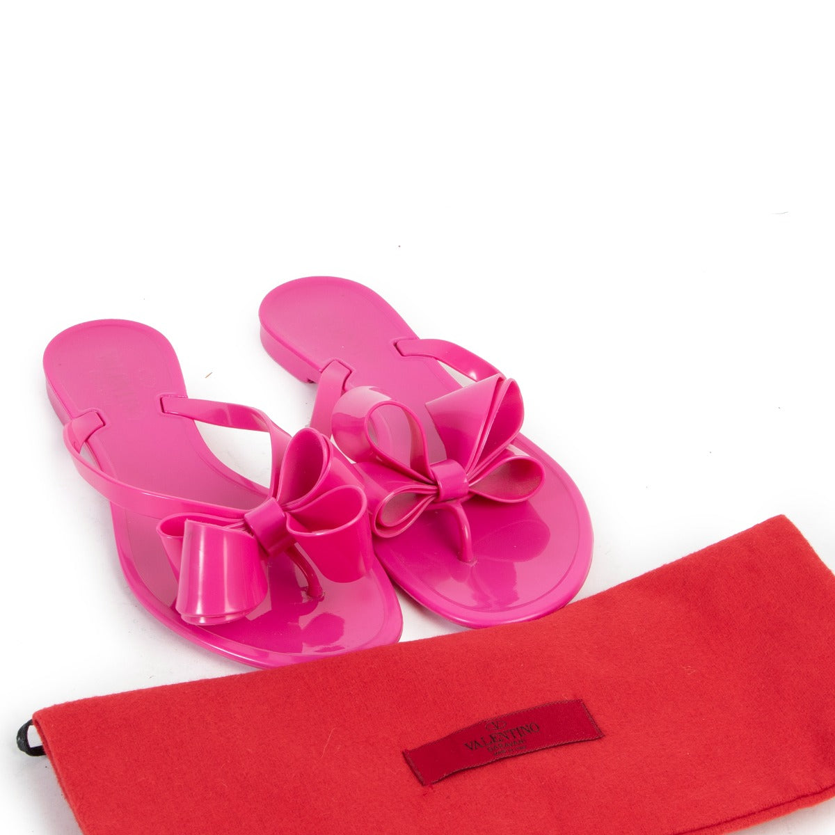 Get these Valentino Pink Jelly Bow Sandals - Size 37 100% authentic and searching for a second life.