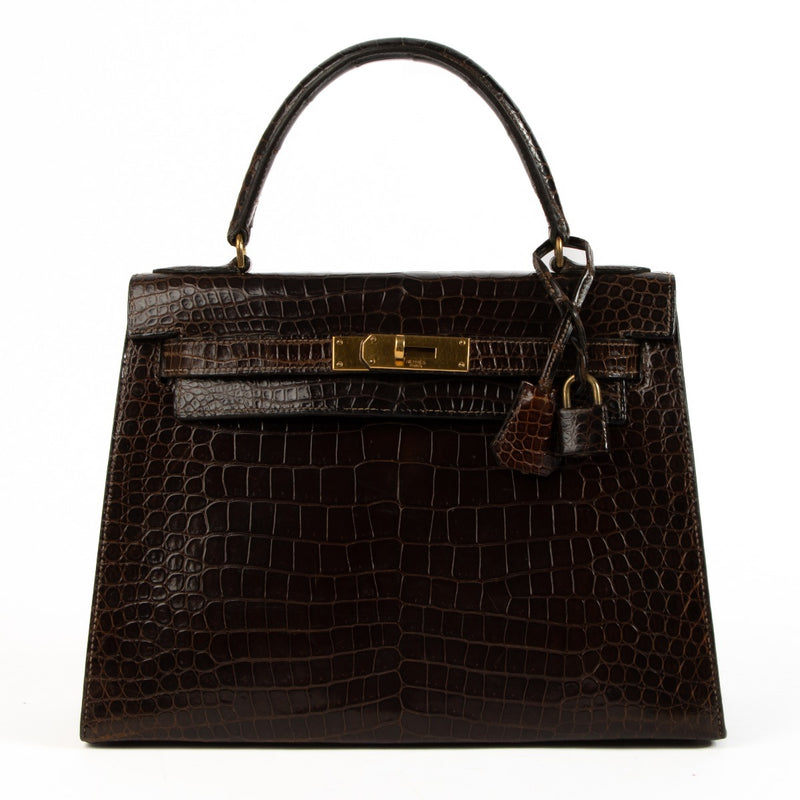 Authhentic second hand Hermès Vintage 1970s Kelly 28 Brown Shiny Porosus Crocodile on www.labellov.com