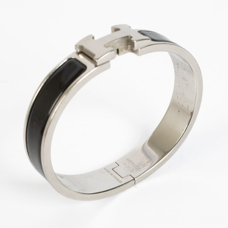 Shop the authentic Hermès Clic H PM Bracelet in black enamel with palladium hardware at Labellov