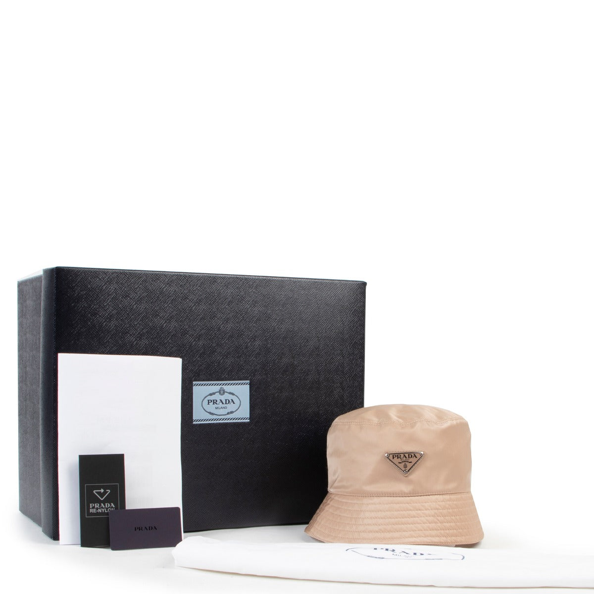 Buy designer accessories at Labellov, such as this Prada Re-Nylon Bucket Hat Cammeo - Size M for a reasonable price and in new condition online or in store. Buy and sell your designer items.