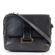 Delvaux Blue Poirier Crossbody Bag We absolutely adore this Poirer handbag. Designed by Delvaux, the oldest fine leather goods house in the world. The handbag is crafted in dark blue leather and finished with a gold toned D in the front. The front f