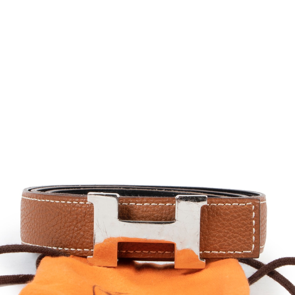 Hermès mini Constance Martelee belt buckle & Reversible leather strap 24 mm is available to be bought at Labellov a luxury secondhand store where you can buy and sell your designer items.