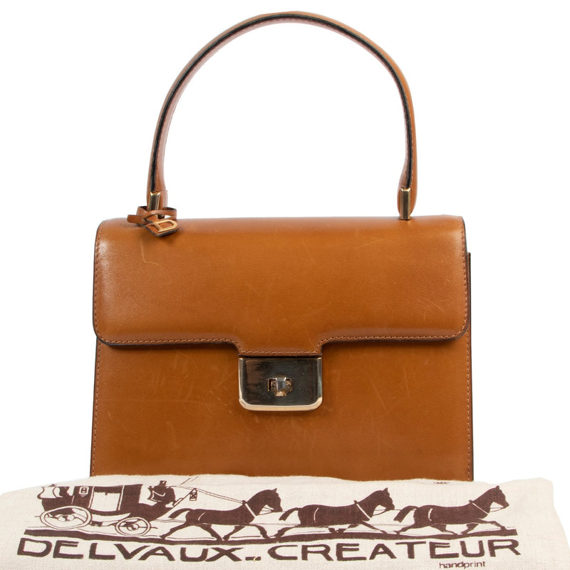 Shop safe online 100% authentic second hand Delvaux Cognac Top Handle Bag at the right price at Labellov in Antwerp.