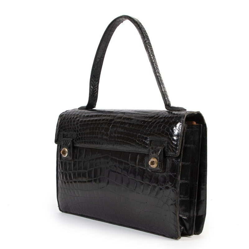 Delvaux Black Croco Vintage Top handle available at Labellov. A true vintage catch for vintage lovers online or in store.