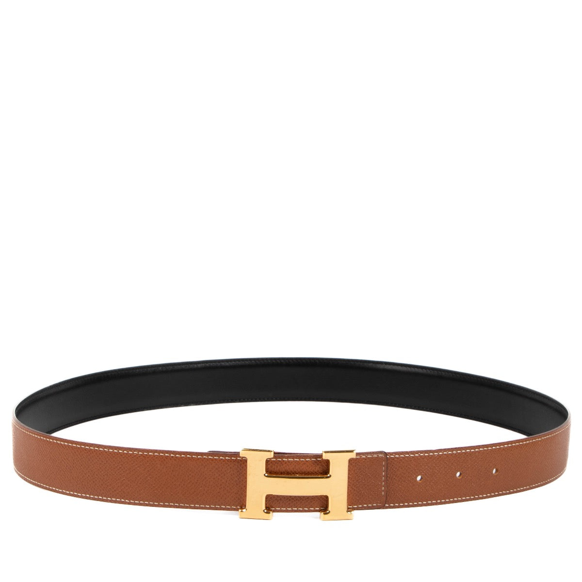 Buy an authentic second hand Hermès black/gold reversible Constance belt in very good condition at Labellov in Antwerp, Knokke, Brussels.