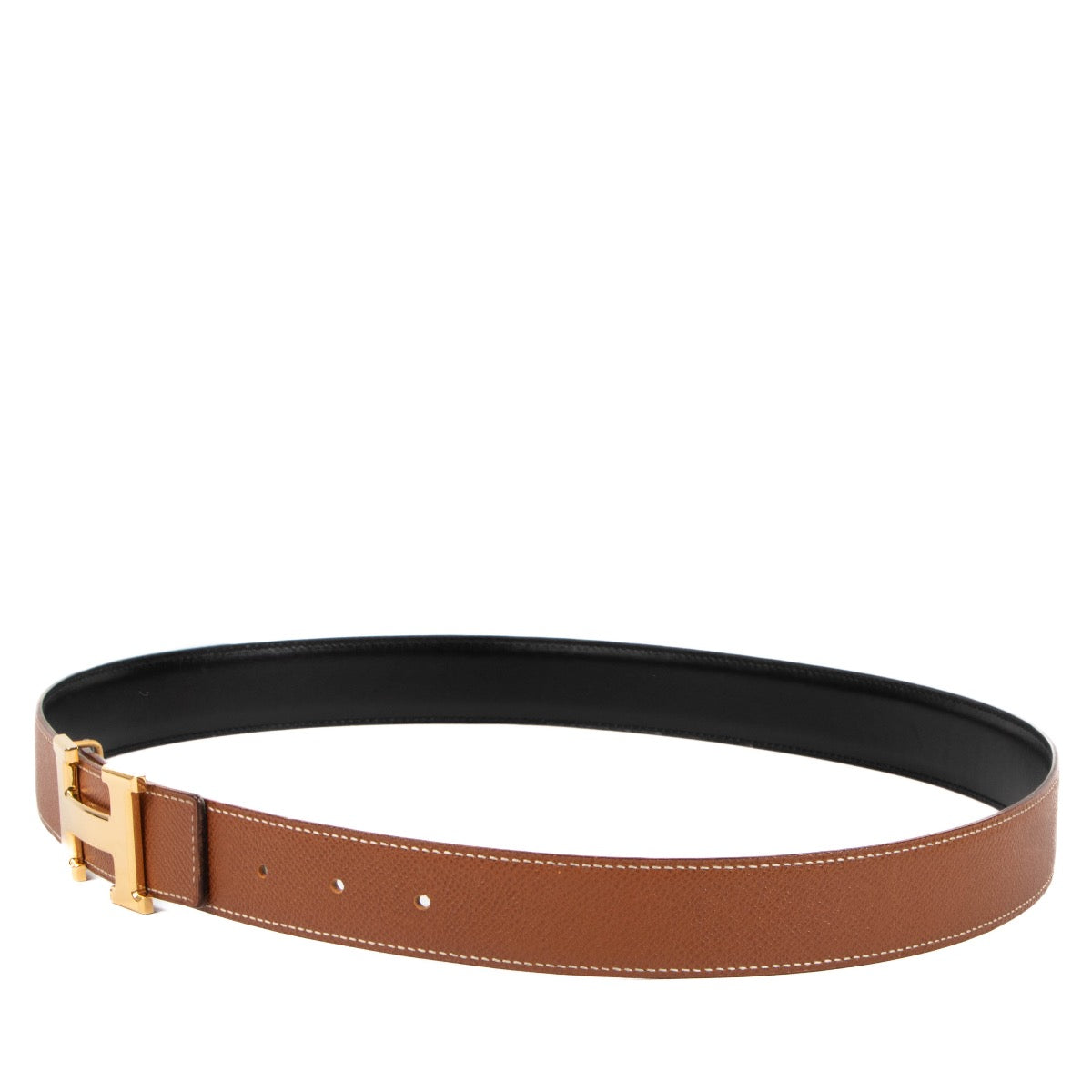 Buy an authentic second hand Hermès black/gold reversible Constance belt in very good condition at Labellov in Antwerp, Knokke, Brussels.