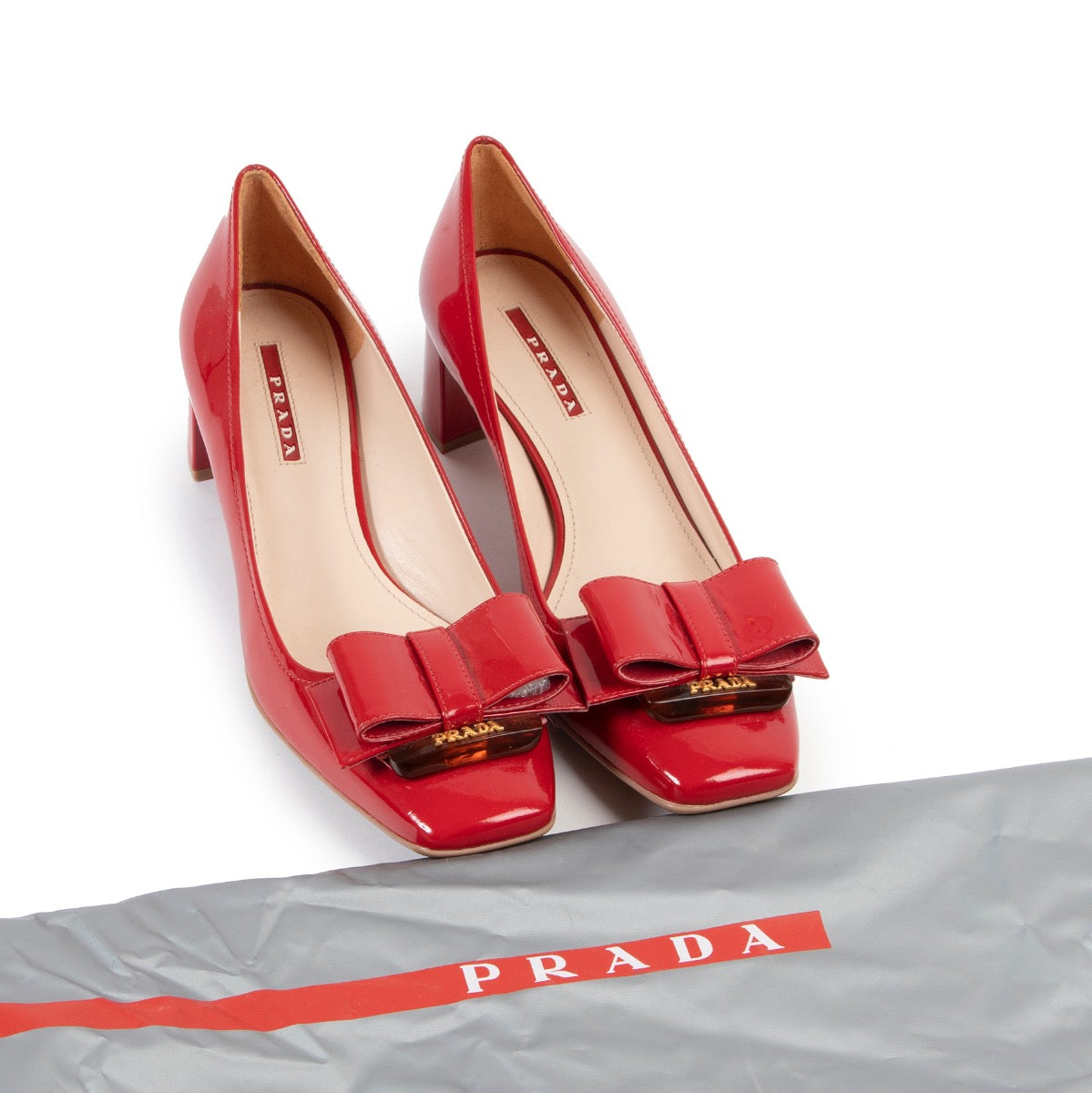 Shop safe online at Labellov in Antwerp this 100% authentic second hand Prada Red Patent Bow Heels - Size 39