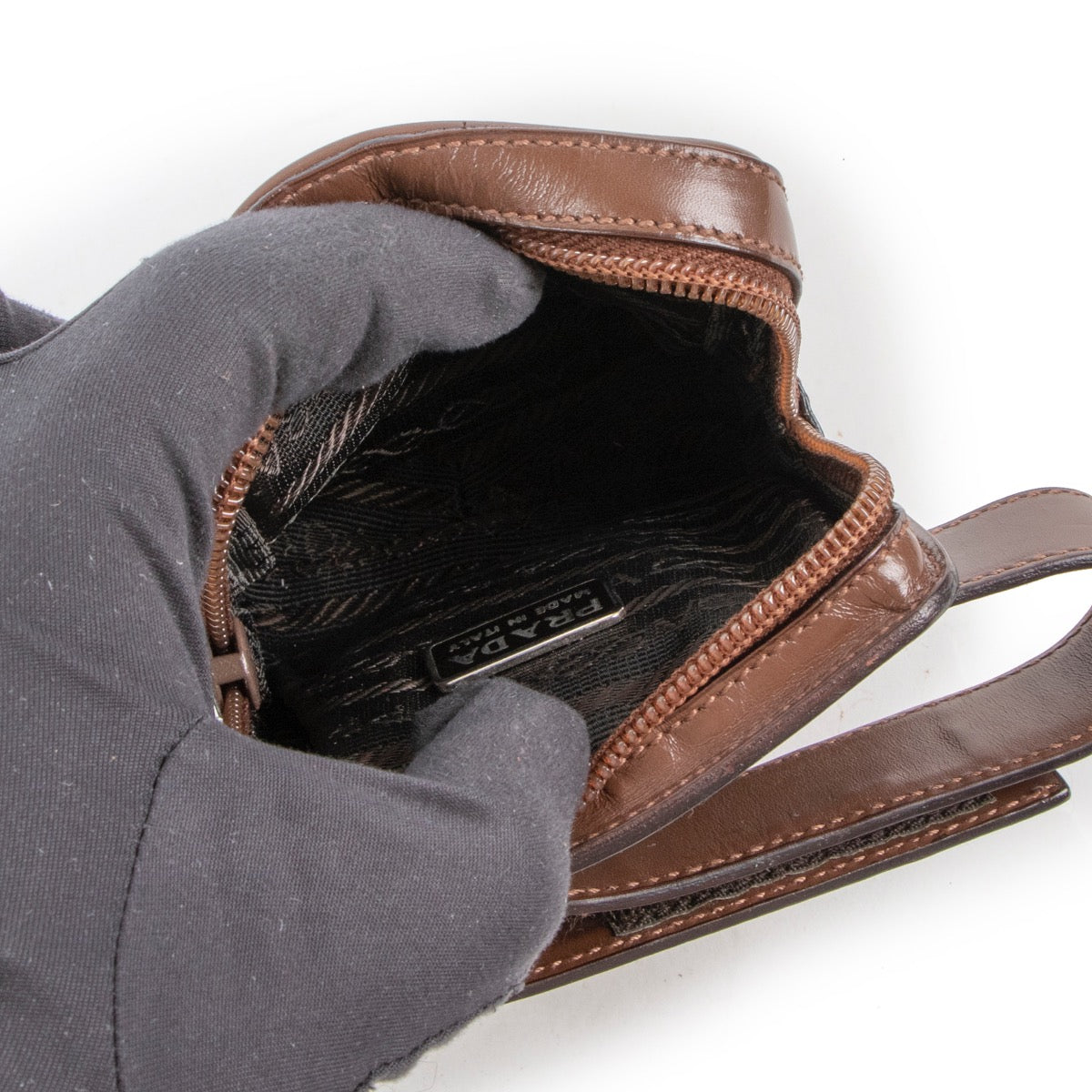 Buy an authentic vintage Prada Brown Leather Wrist Mini Pouch at Labellov Antwerp.