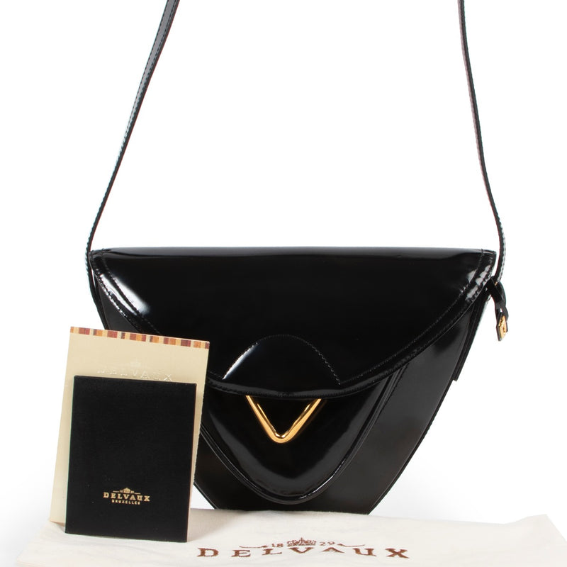 Shop safe online 100% authentic second hand Delvaux Black Patent Leather Triangle Crossbody Bag in very good condition at the right price at Labellov in Antwerp.