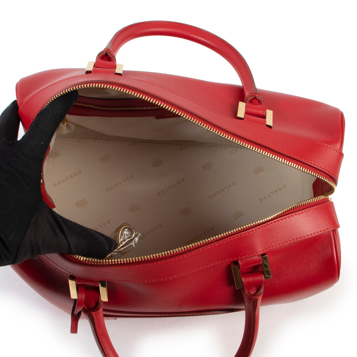 Vintage Delvaux Red Louise Boston handle in good condition on Labellov website for 2nd hand designers