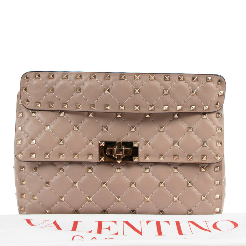 Are you looking for an authentic Valentino Garavani Beige Rockstud Spike Top Handle? We buy and sell your authentic designer bags online.