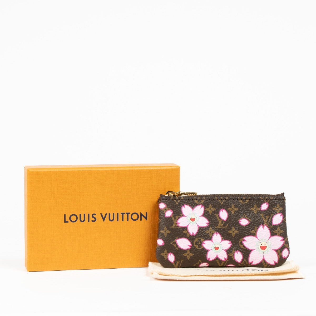 Authentic pre-loved Louis Vuitton Monogram Cherry Blossom Key Pouch on Labellov.com